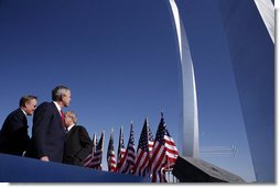President George W. Bush observes the Air Force Thunderbirds performing at the dedication of the United State Air Force Memorial in Arlington, Virginia on October 14, 2006. White House photo by Paul Morse