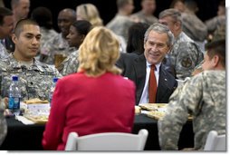 President George W. Bush talks with U.S.troops and their families over lunch during his visit to Fort Benning, Ga., Thursday, Jan. 11, 2007.  White House photo by Eric Draper